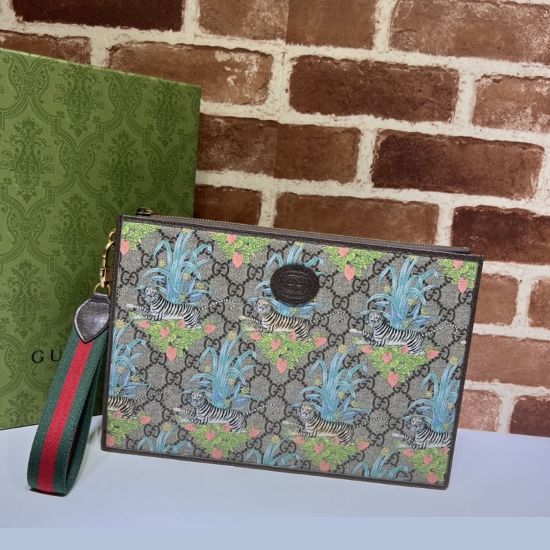 G*u*i clutch bags